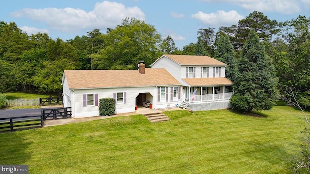  - view of front facade featuring a chimney