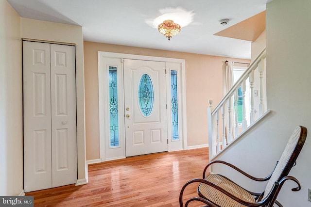  - foyer with light wood-style flooring