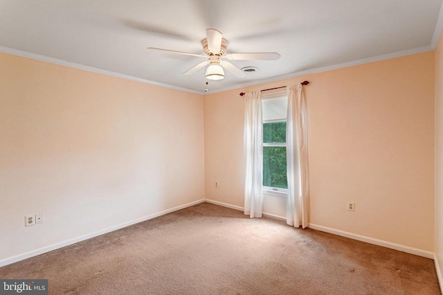  - carpeted empty room with ceiling fan and crown molding