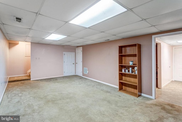  - finished basement with a paneled ceiling, carpet floors, and stairway