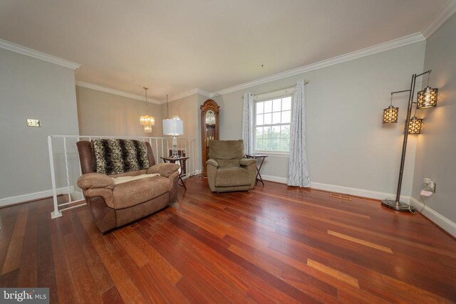  - living area with wood finished floors, crown molding, and a chandelier