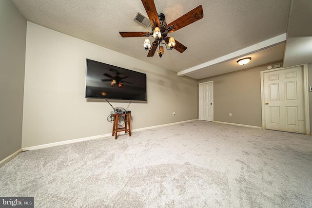  - unfurnished living room featuring carpet flooring, ceiling fan, and a textured ceiling