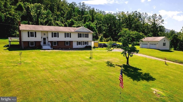 - bi-level home featuring a front lawn and entry steps