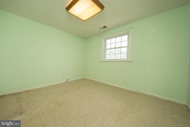  - carpeted spare room with baseboards