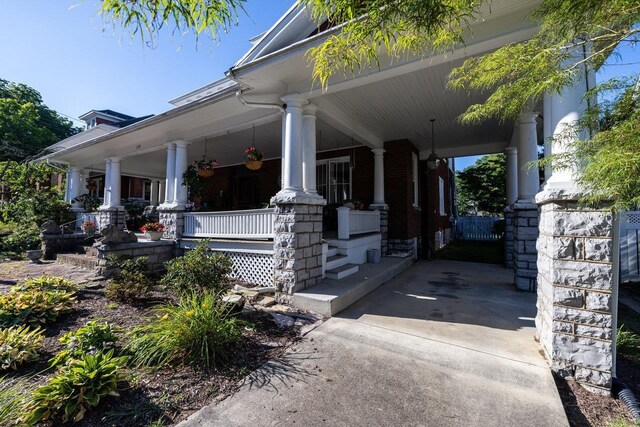 289 Newman Ave, Harrisonburg, VA 22801 - view of side of home featuring a porch and brick siding
