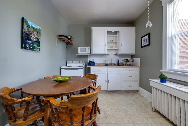 289 Newman Ave, Harrisonburg, VA 22801 - kitchen featuring white appliances, open shelves, white cabinetry, and decorative light fixtures