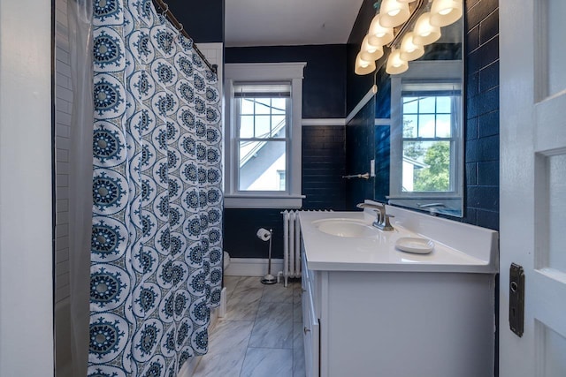289 Newman Ave, Harrisonburg, VA 22801 - full bath featuring vanity, marble finish floors, radiator heating unit, a shower with shower curtain, and a chandelier