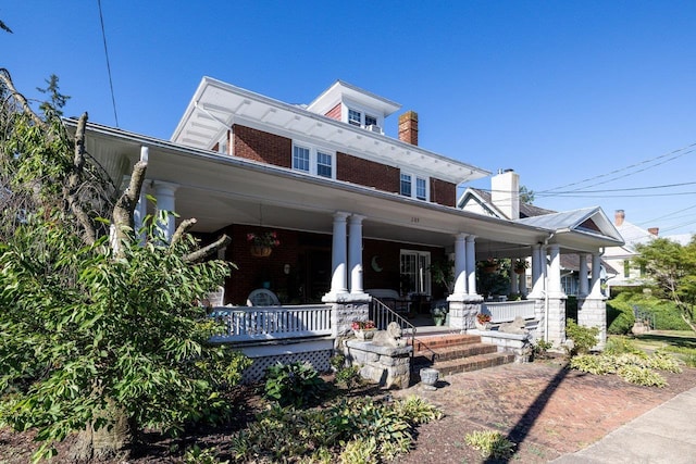 289 Newman Ave, Harrisonburg, VA 22801 - view of front facade with a porch, brick siding, and a chimney