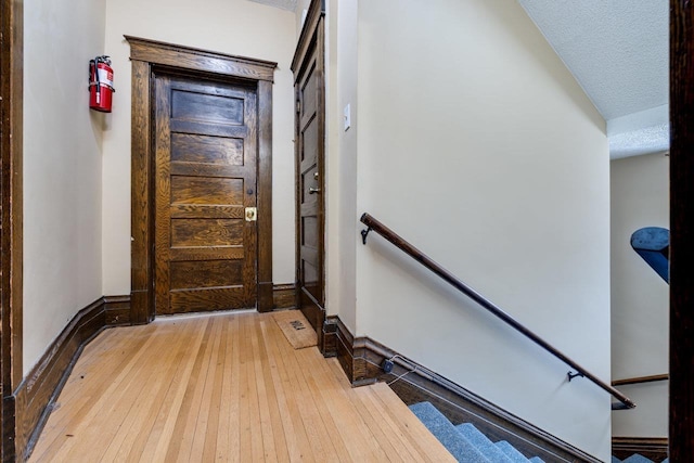 289 Newman Ave, Harrisonburg, VA 22801 - doorway to outside with wood-type flooring, a textured ceiling, and baseboards