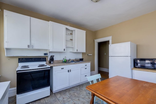 289 Newman Ave, Harrisonburg, VA 22801 - kitchen with electric range oven, freestanding refrigerator, baseboards, white cabinets, and open shelves