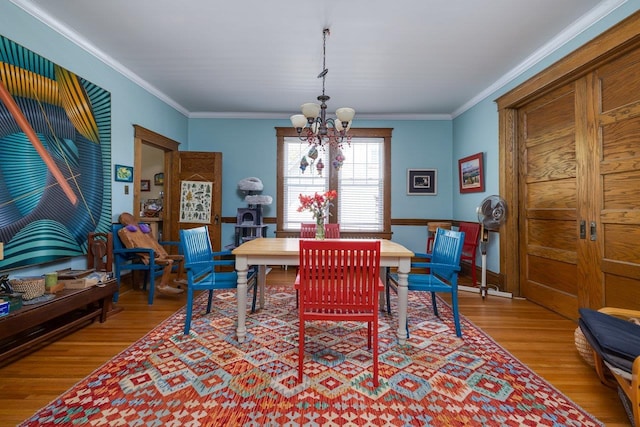 289 Newman Ave, Harrisonburg, VA 22801 - dining area featuring a chandelier, wood finished floors, and ornamental molding