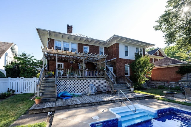 289 Newman Ave, Harrisonburg, VA 22801 - back of property with stairway, a wooden deck, a chimney, and brick siding