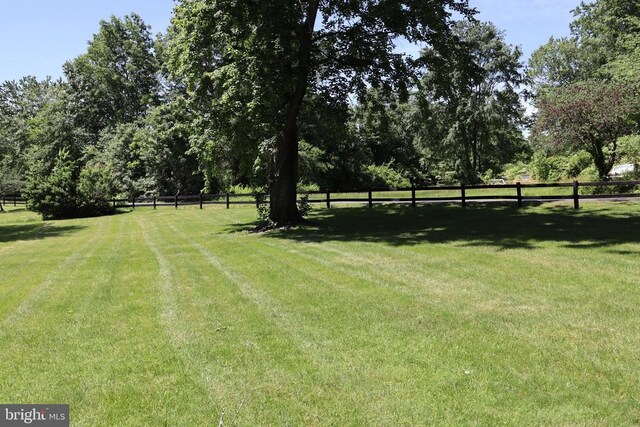  - view of grassy yard with a gazebo and view of scattered trees