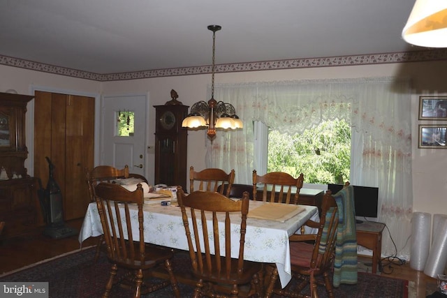  - dining area with a chandelier