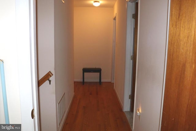  - hall featuring wood finished floors