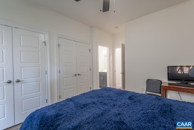 bedroom with two closets and ceiling fan