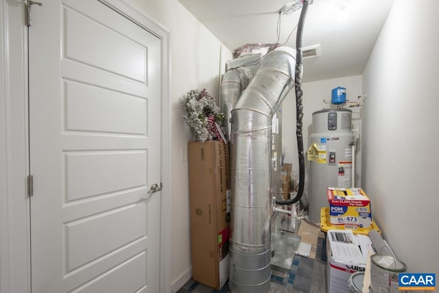 utility room featuring water heater
