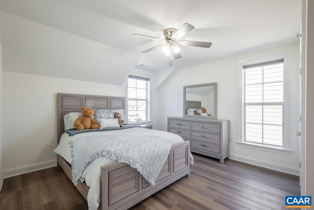 bedroom with wood finished floors, baseboards, vaulted ceiling, and ceiling fan