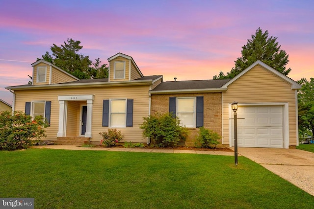 10807 Bent Tree Dr, Fredericksburg, VA 22407 - view of front of home featuring a garage, a lawn, concrete driveway, and brick siding