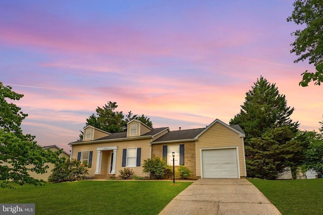 10807 Bent Tree Dr, Fredericksburg, VA 22407 - view of front of house with an attached garage, concrete driveway, a front lawn, and brick siding