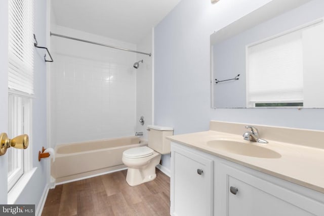10807 Bent Tree Dr, Fredericksburg, VA 22407 - full bath with vanity, wood finished floors, toilet, washtub / shower combination, and plenty of natural light