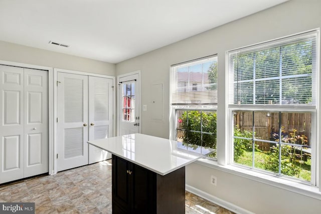 7688 Wankoma Dr, Remington, VA 22734 - kitchen featuring healthy amount of natural light, light countertops, and baseboards