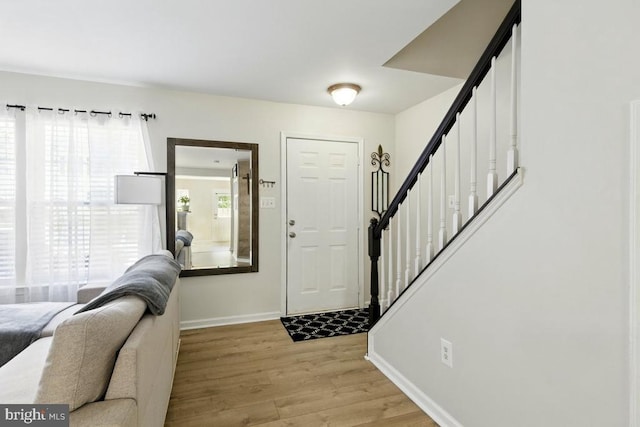 7688 Wankoma Dr, Remington, VA 22734 - entrance foyer featuring stairway, light wood-style floors, and baseboards