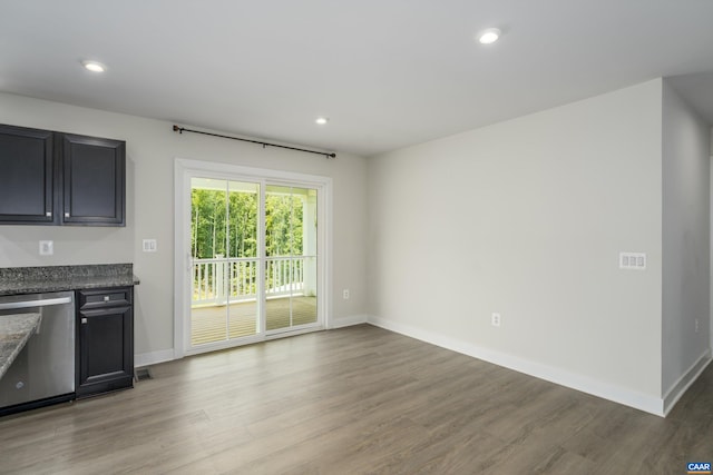 107 Archer Dr, Palmyra, VA 22963 - kitchen featuring stainless steel dishwasher, light wood finished floors, baseboards, recessed lighting, and dark stone counters