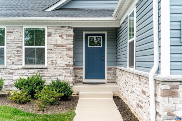 107 Archer Dr, Palmyra, VA 22963 - entrance to property with a shingled roof and stone siding