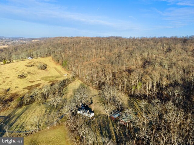 - drone / aerial view of a heavily wooded area
