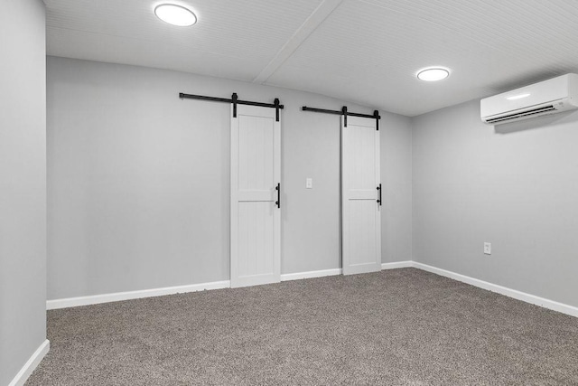 14372 E Side Hwy S, Grottoes, VA 24401 - below grade area with an AC wall unit, a barn door, carpet flooring, and baseboards