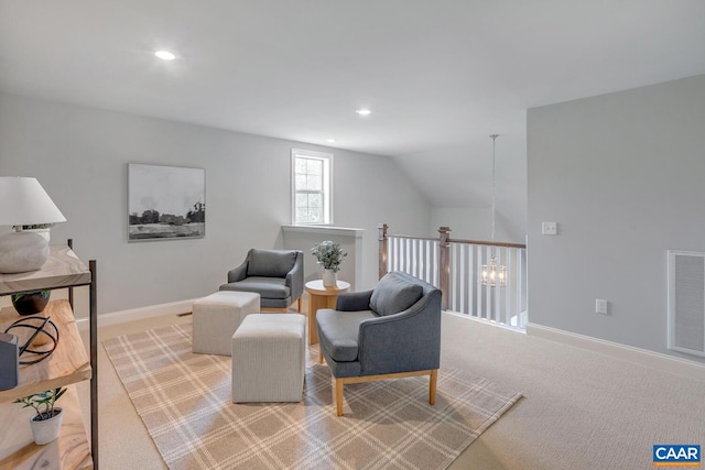 living area featuring an upstairs landing, vaulted ceiling, visible vents, and recessed lighting