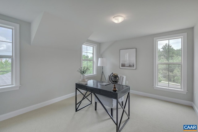 home office featuring light carpet and baseboards