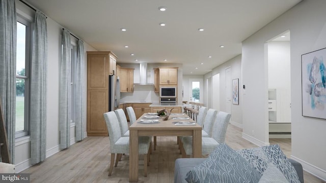 dining area with recessed lighting, light wood-type flooring, and baseboards