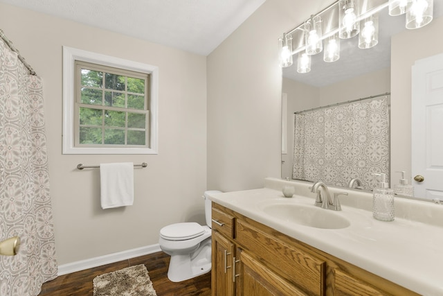 740 Confederacy Dr, Penn Laird, VA 22846 - bathroom featuring vanity, wood finished floors, toilet, baseboards, and a chandelier