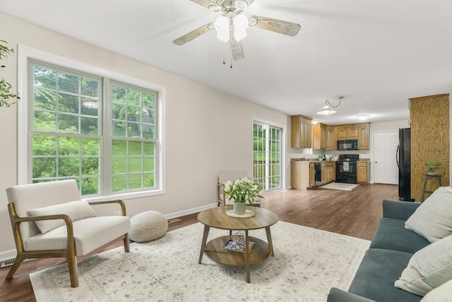 740 Confederacy Dr, Penn Laird, VA 22846 - living area featuring dark wood finished floors, baseboards, and ceiling fan