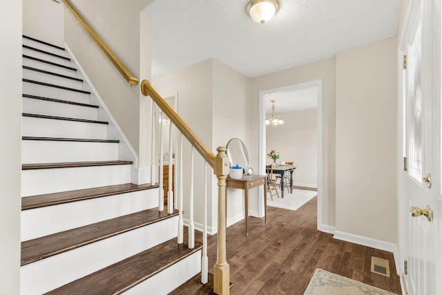 740 Confederacy Dr, Penn Laird, VA 22846 - foyer entrance with wood finished floors, stairway, baseboards, and a chandelier