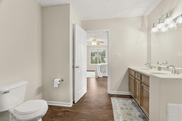 740 Confederacy Dr, Penn Laird, VA 22846 - ensuite bathroom with wood finished floors, baseboards, double vanity, and toilet