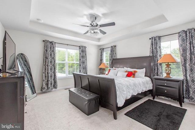 3801 Drayton Ct, Fredericksburg, VA 22408 - bedroom with a raised ceiling, carpet, multiple windows, and a ceiling fan