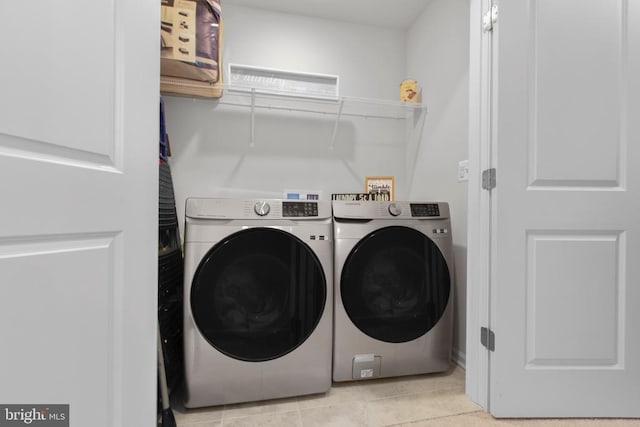 3801 Drayton Ct, Fredericksburg, VA 22408 - washroom with washer and clothes dryer and light tile patterned floors