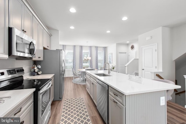3801 Drayton Ct, Fredericksburg, VA 22408 - kitchen featuring appliances with stainless steel finishes, gray cabinets, light wood-style flooring, light countertops, and recessed lighting