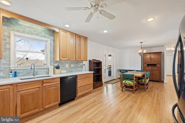 9107 Grasty Gold Mine Rd, Rhoadesville, VA 22542 - kitchen featuring black dishwasher, a sink, freestanding refrigerator, backsplash, and ceiling fan