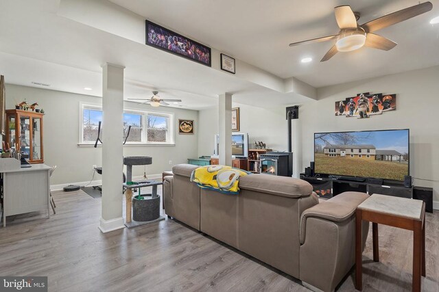 9107 Grasty Gold Mine Rd, Rhoadesville, VA 22542 - living area with ceiling fan, a wood stove, wood finished floors, baseboards, and recessed lighting