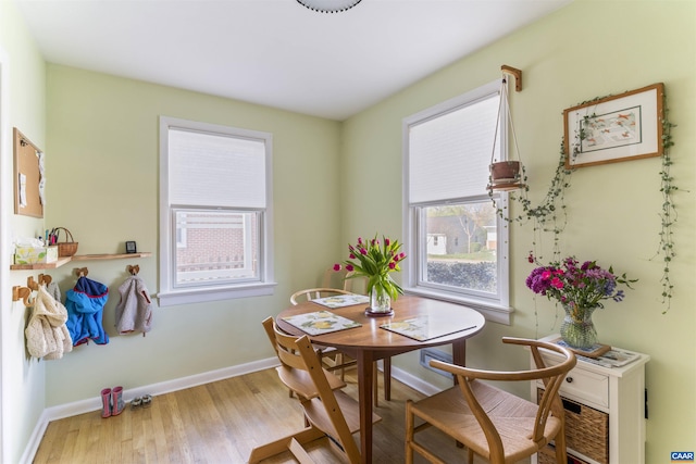 dining area featuring wood finished floors and baseboards