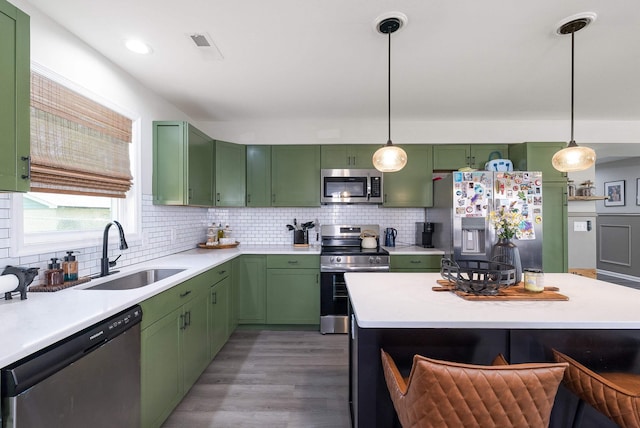16715 Prospect Ave E, Elkton, VA 22827 - kitchen with stainless steel appliances, a sink, green cabinets, and light countertops