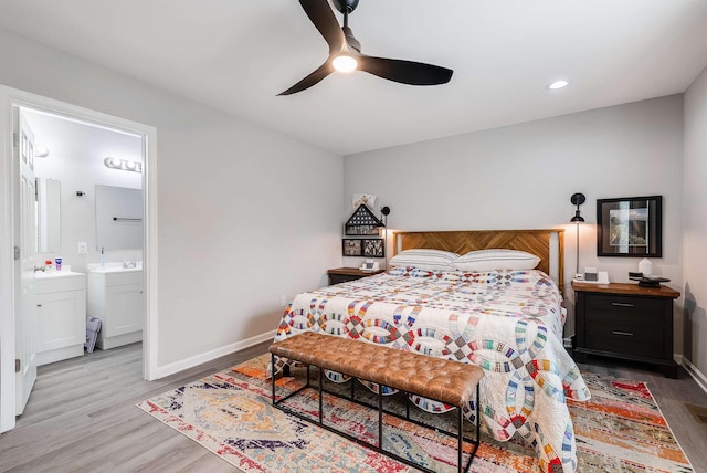 16715 Prospect Ave E, Elkton, VA 22827 - bedroom with light wood finished floors, baseboards, a sink, a ceiling fan, and ensuite bath