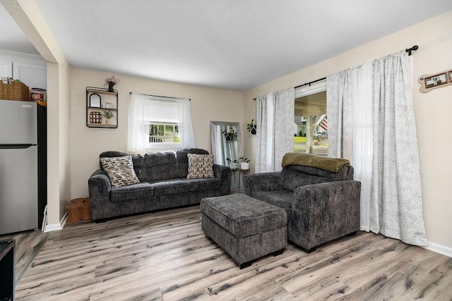58 Augusta St, Verona, VA 24482 - living room featuring light wood-style flooring and baseboards