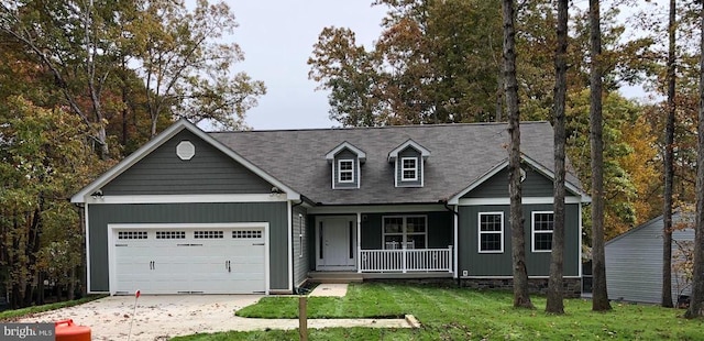 view of front facade featuring a porch, an attached garage, concrete driveway, a front lawn, and a shingled roof