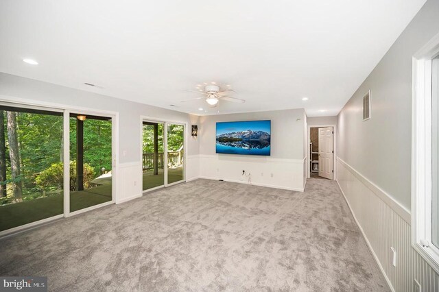 14906 Laurel Point Ln, Spotsylvania, VA 22551 - unfurnished living room with ceiling fan, a wainscoted wall, carpet flooring, recessed lighting, and a decorative wall