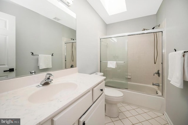 14906 Laurel Point Ln, Spotsylvania, VA 22551 - bathroom featuring a skylight, vanity, tile patterned floors, and bath / shower combo with glass door